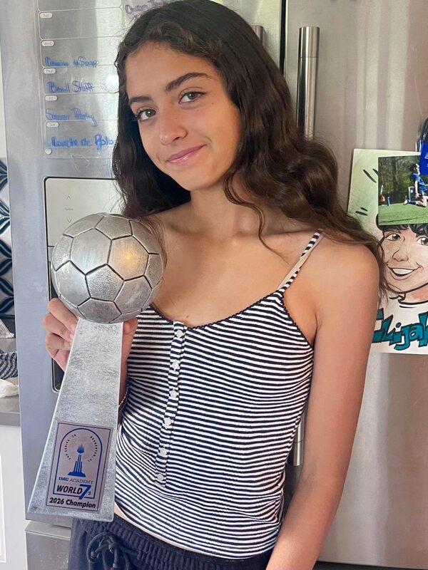 Tim and Jan’s granddaughter with her 2026 soccer championship trophy